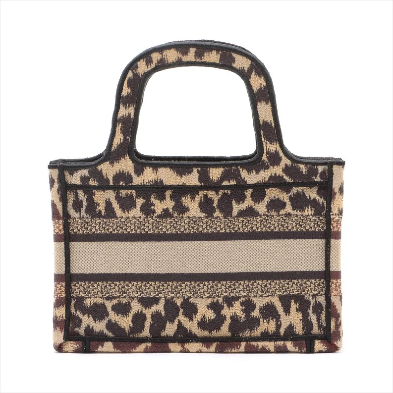 Refined Elegance: Dior’s Signature HandbagsChristian Dior Mini Book Tote Canvas Handbag Leopard