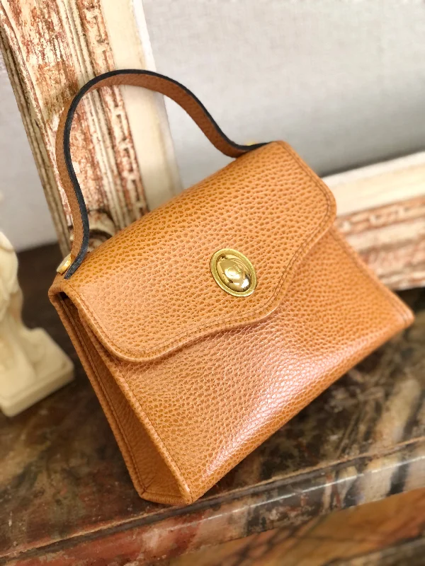 The Dior Handbag That Completes Your LookChristian Dior Logo Oval Motif Embossed Leather Top Handle Handbag Mini bag Camel Vintage old e8dit3