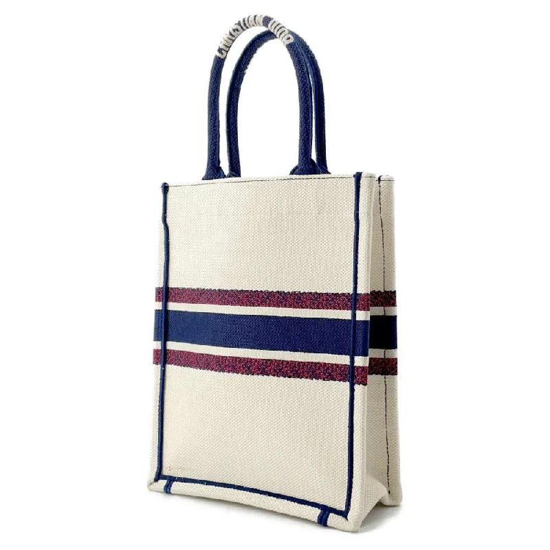 The Dior Bag Every Woman DeservesDior book tote vertical Ivory/Navy/Red Canvas Size Mini