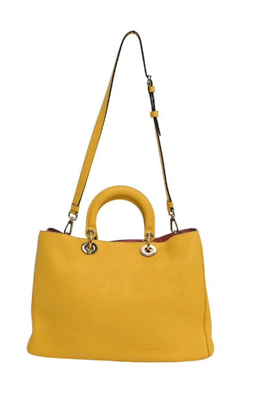 Step into the World of Luxury with DiorCHRISTIAN DIOR Yellow grained leather Diorissimo top handle shopper tote with detachable shoulder strap