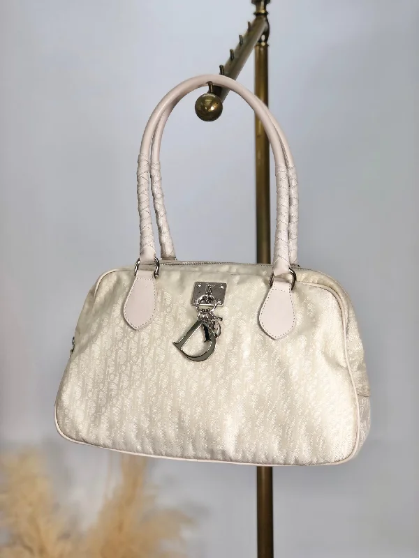 Explore the Essence of Luxury with DiorChristian Dior Trotter Logo Charm Handbag Beige Vintage 3t7wy7